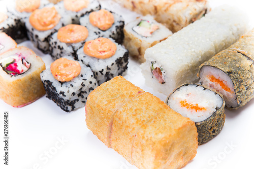 Japanese food restaurant, sushi maki gunkan roll plate or platter set. California Sushi rolls with salmon. Sushi isolated at white background. Top view, flat lay. photo