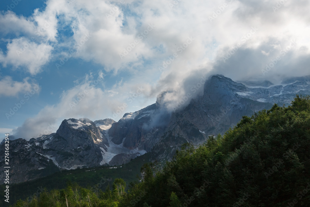 Gray high rocky mountain located. Caucasian reserve, mountain Fisht