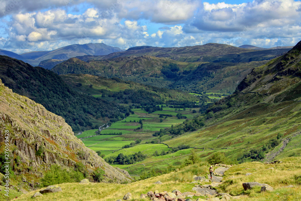 A stunning scenery of the natural beauty of the Lake District with mountains, rivers, lakes and green grass. Styhead path. Cumbria, England, UK. National Park.