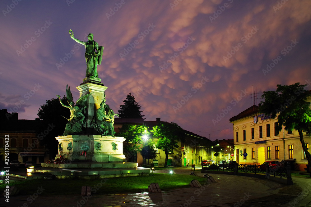 Stormy clouds over the monument and buildings of the Reconciliation Park of Arad, Romania, Europe