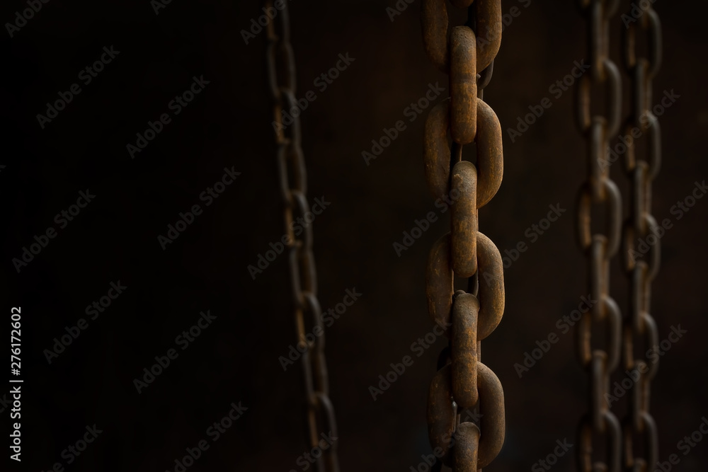 Close up rusty on the group of old chains in low light with copy space. Selective focus and vintage processed. Background for a business target or network system concept. Close up rusty on the group of old chains in low light with copy space. Selective focus and vintage processed. Background for a business target or network system concept.