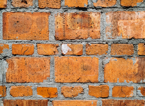 Red brick wall texture background. Old weathered surface.