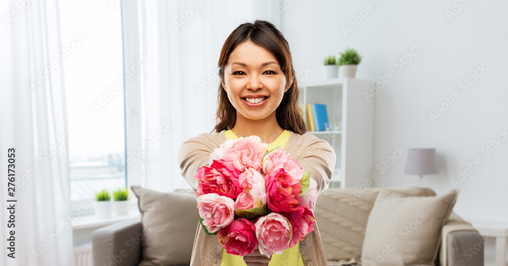 people and international women's day concept - happy asian young woman with bunch of peony flowers over home background people and international women's day concept - happy asian young woman with bunch of peony flowers over home background