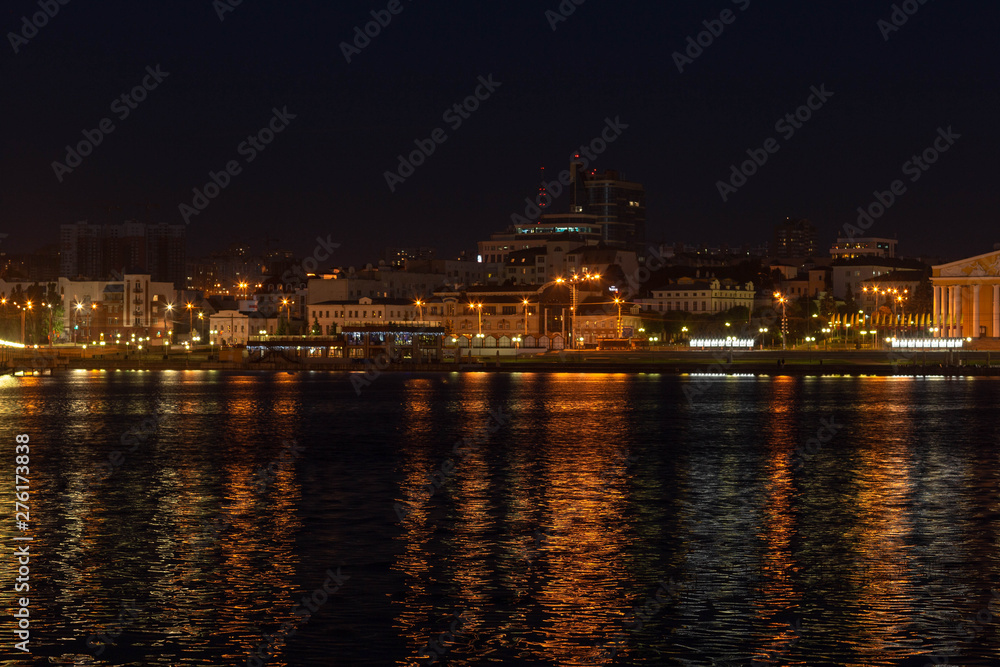 Lights evening Cheboksary with reflections in the water,shot on a summer evening