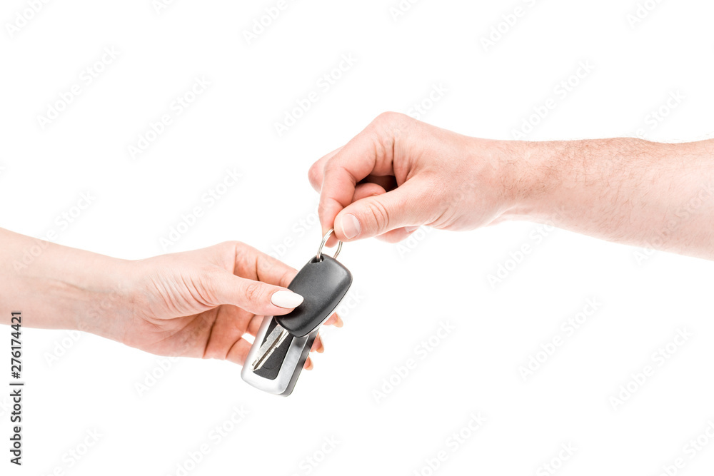 cropped view of man and woman holding keys isolated on white cropped view of man and woman holding keys isolated on white