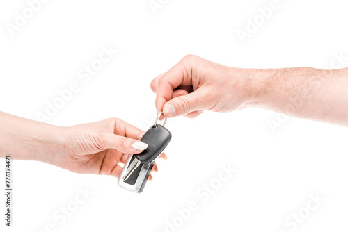 cropped view of man and woman holding keys isolated on white