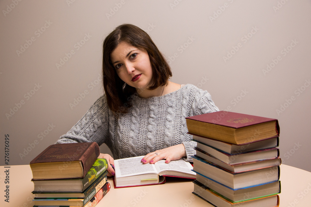 Student girl with stack of books Student girl with stack of books
