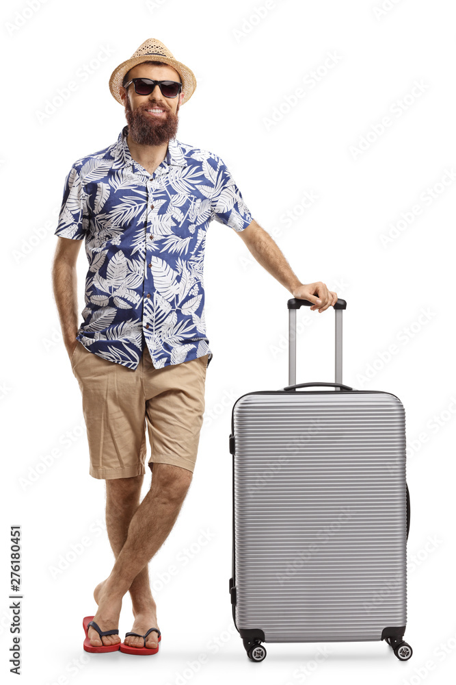 Bearded man tourist posing with a suitcase Bearded man tourist posing with a suitcase