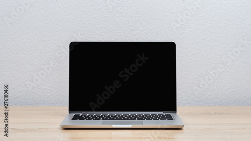 Dark screen open laptop on your desktop. Mock up.