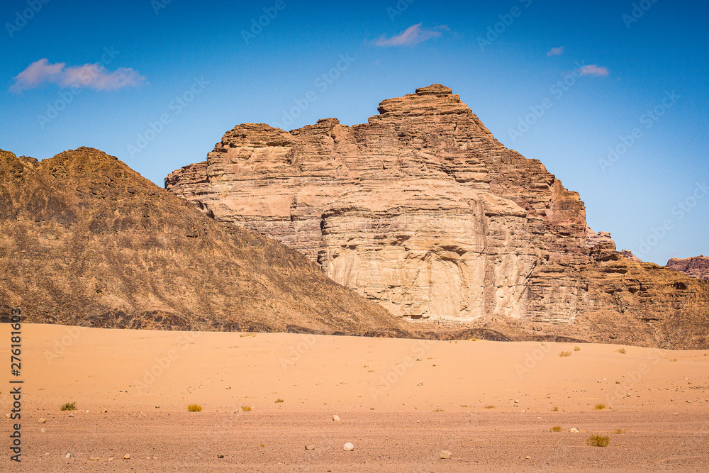 Desert with sandstone and granite rock in shape of boat in Wadi Rum in Jordan Desert with sandstone and granite rock in shape of boat in Wadi Rum in Jordan
