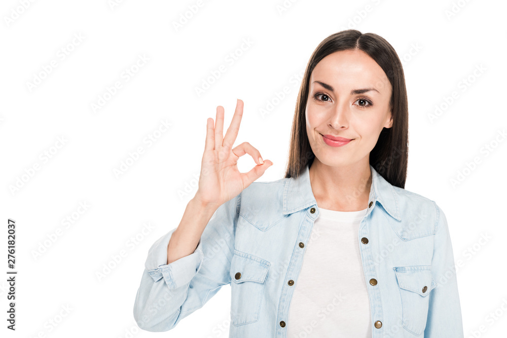 smiling brunette woman showing ok sign isolated on white smiling brunette woman showing ok sign isolated on white