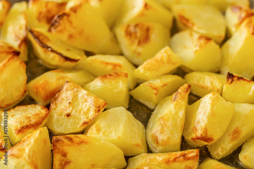 Delicious baked potatoes on glass plate, closeup Delicious baked potatoes on glass plate, closeup