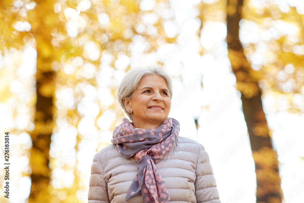 old age, retirement and season concept - portrait of happy senior woman at autumn park old age, retirement and season concept - portrait of happy senior woman at autumn park