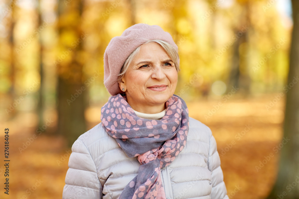 old age, retirement and season concept - portrait of happy senior woman at autumn park old age, retirement and season concept - portrait of happy senior woman at autumn park