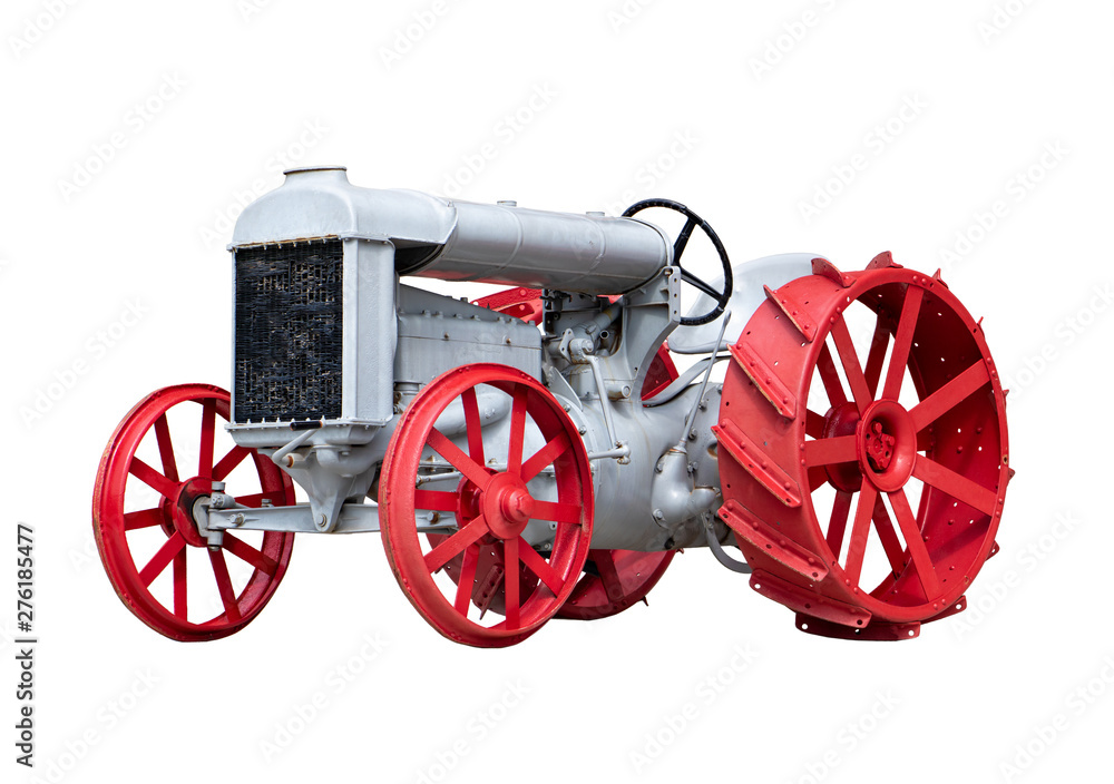 Historically tractor, isolated on a white background. Retro tractor in a perfect technical condition.