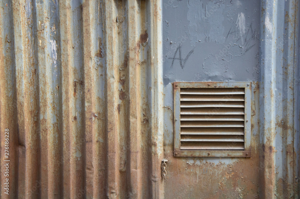 Background and detail of Old rusted zinc wall  ventilation hatch