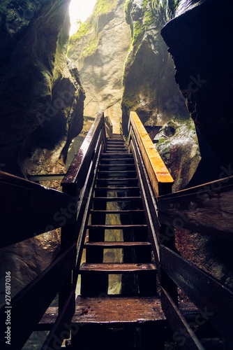 Fototapeta Naklejka Na Ścianę i Meble -  Stairs in the Seisenbergklamm gorge. Natural wonder including huge caverns, deep gorge with rapids and wood walkways..