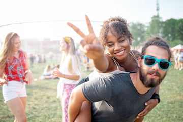 Multiethnic group of people having fun at summer music festival
