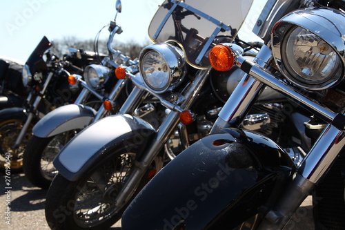 Four motorcycles close-up, standing in a row