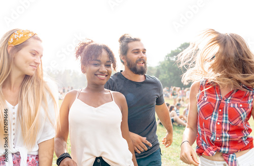Group of young people having fun at music festival