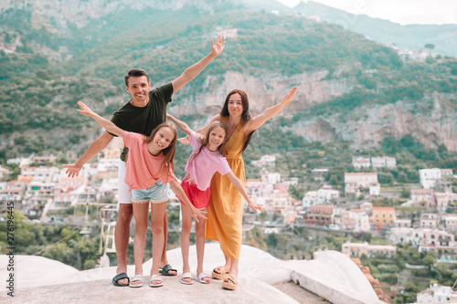 Summer holiday in Italy. Young woman in Positano village on the background, Amalfi Coast, Italy