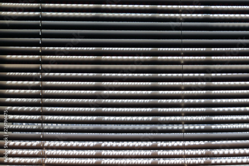 lights coming through window blinds on midday