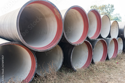 Bild auf Leinwand side view of ductile iron pipes stored in open space store yard.