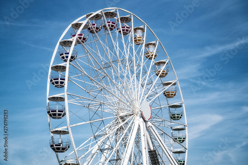 Ferris Mill, big  wheel on a background of blue sky.