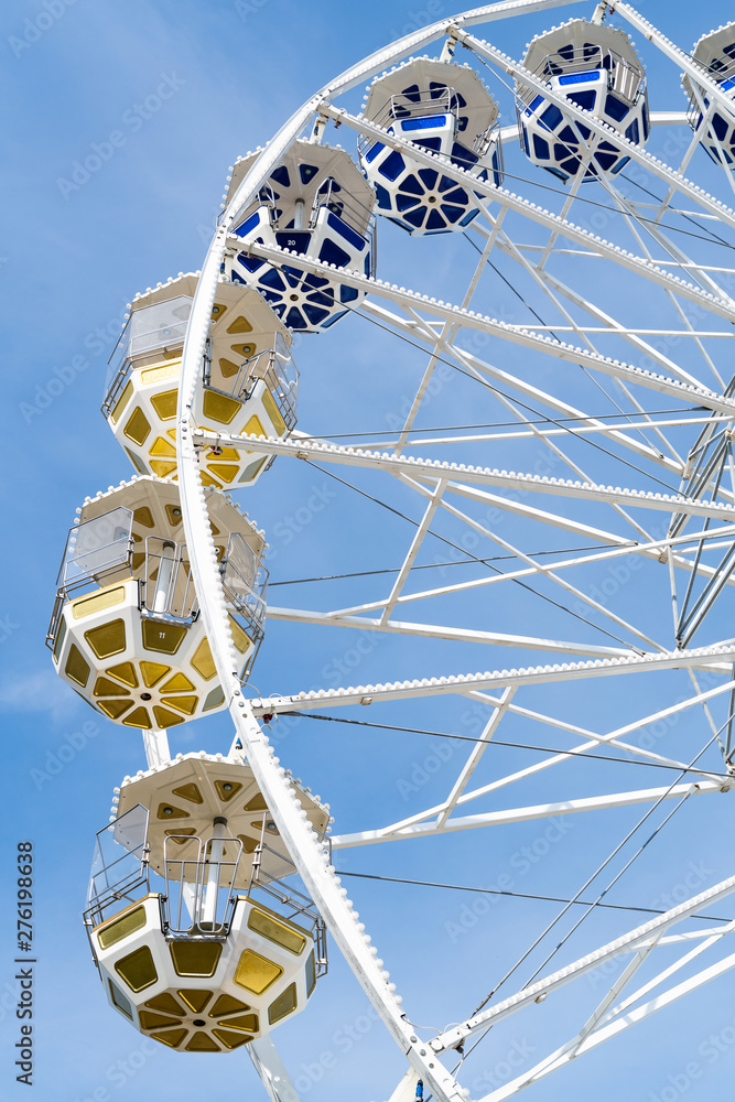 Ferris Mill, big  wheel on a background of blue sky.