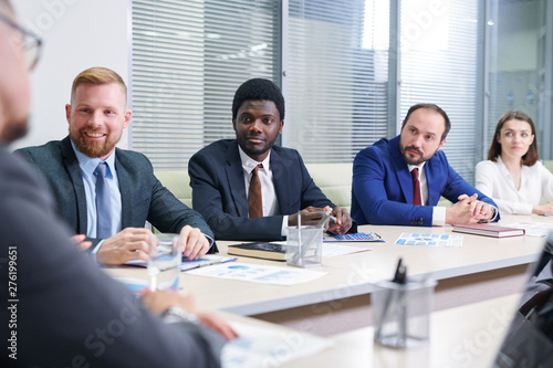 Wallpaper Mural Several multicultural traders in formalwear listening to coach Torontodigital.ca