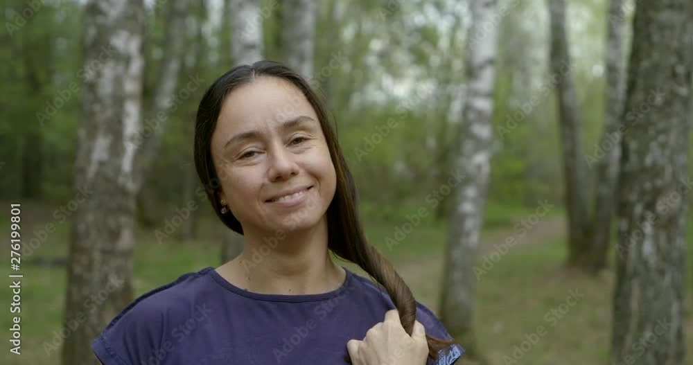 beautiful adult woman close-up portrait on a walk breathe in the forest to enjoy the beauty and purity of nature beautiful adult woman close-up portrait on a walk breathe in the forest to enjoy the beauty and purity of nature