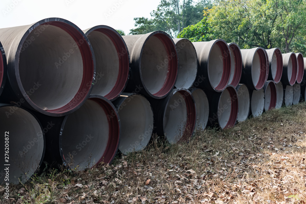 ductile iron pipes stocked in open space of a rural village store yard. ductile iron pipes stocked in open space of a rural village store yard.