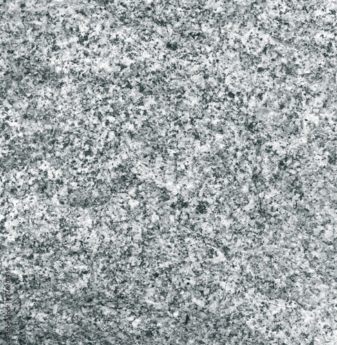Granular texture of granite closeup. Rough stone surface.