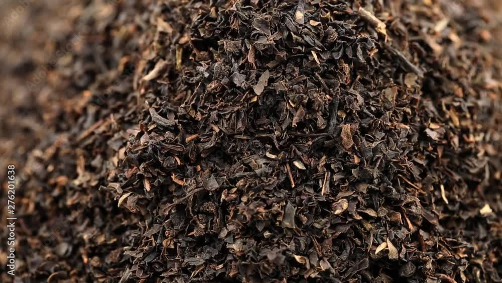 Heap of dried black tea leaf crop rotating close up view Heap of dried black tea leaf crop rotating close up view