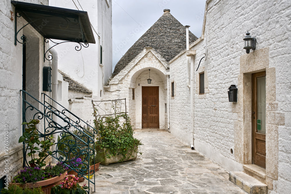 Old trulli houses in Alberobello town in Italy