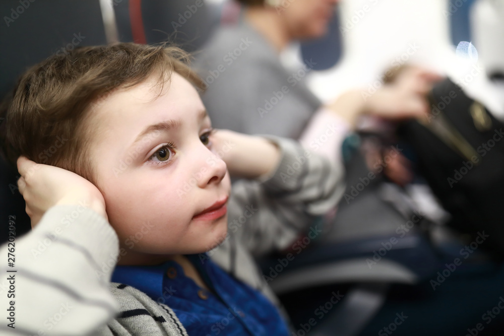 Boy suffer discomfort from increased ear pressure Boy suffer discomfort from increased ear pressure
