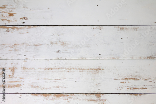 White wooden floorboards. Distressed worn floorboard background painted white