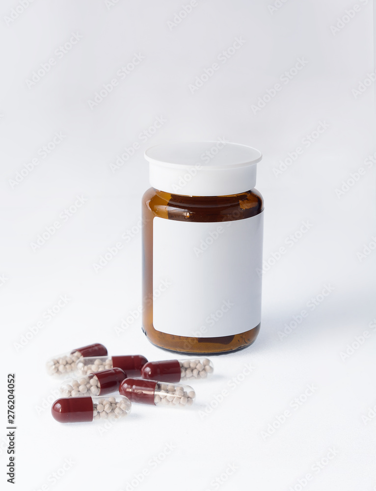 Pancreatin capsules with bottle. Pills isolated on white background. Clean label on drug bottle. Pancreatin capsules with bottle. Pills isolated on white background. Clean label on drug bottle.
