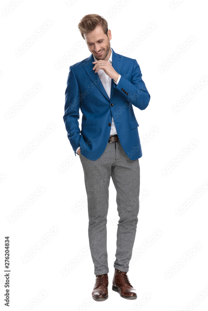 Cheerful casual men laughing, holding his hand in his pocket Cheerful casual men laughing, holding his hand in his pocket