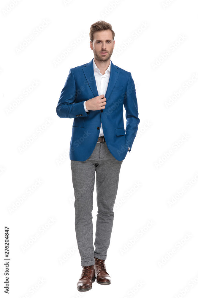 Charming casual guy adjusting his jacket Charming casual guy adjusting his jacket