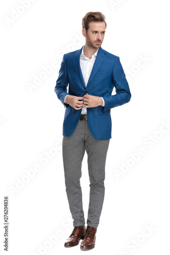 Tough casual man adjusting his buttons