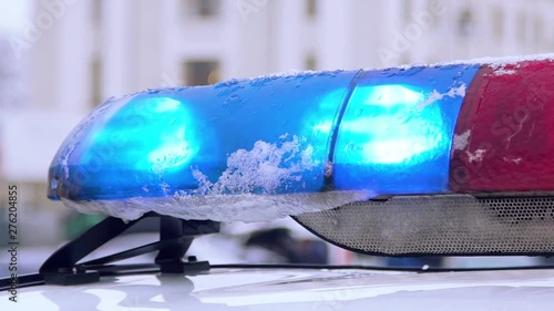 Police car light bar in action. The police beacon on the car. Close up view of full array of police car lights.