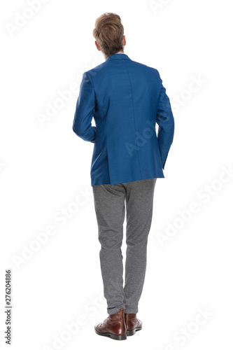 Tableau sur toile Rear view of a curious casual guy looking up