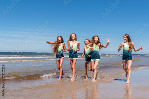 Girls walking on the beach