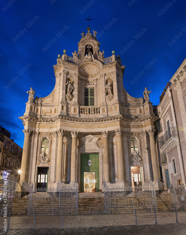 Catania - The baroque facade of church Basilica Collegiata at dusk.