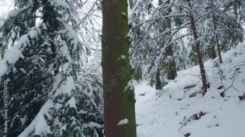 Scared anxious man in traditional winter costume of peasant medieval age running in snowy dark forest. Get lost, unhappy, danger. Bad mood, negative emotions, terrible