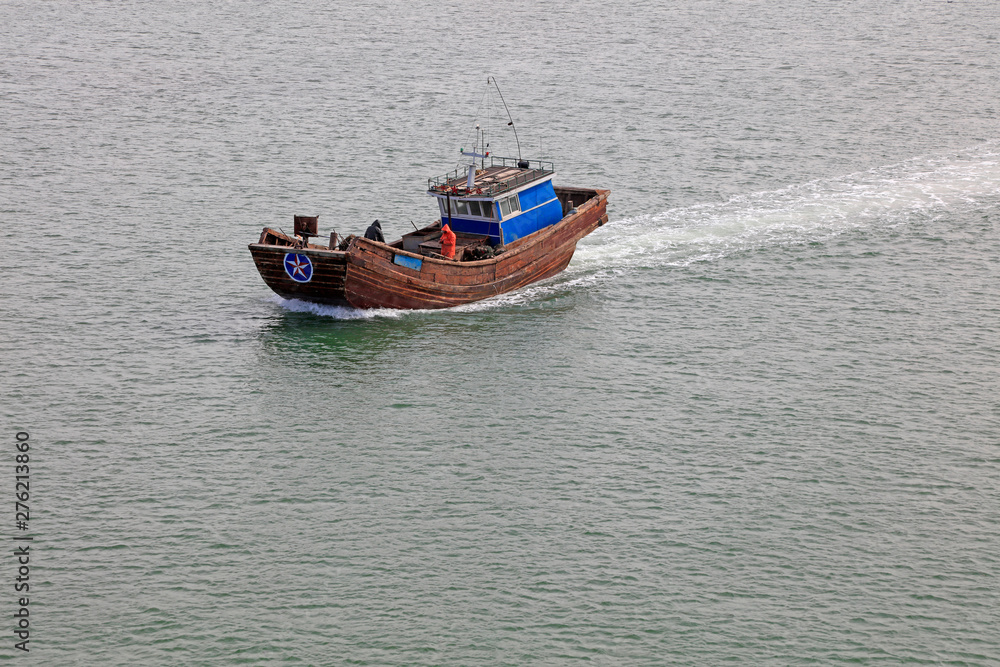 fishing boat driving in the sea