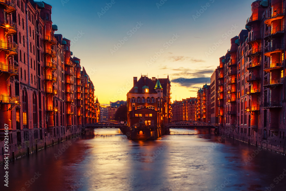The Warehouse district Speicherstadt during twilight sunset in Hamburg, Germany. Illuminated warehouses in Hafencity quarter in Hamburg.
