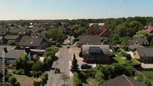 Wallpaper Mural The span of the camera over the roofs of a small German city. The postman's van goes through a small German city. Greven, Germany. Aerial view 4K Torontodigital.ca