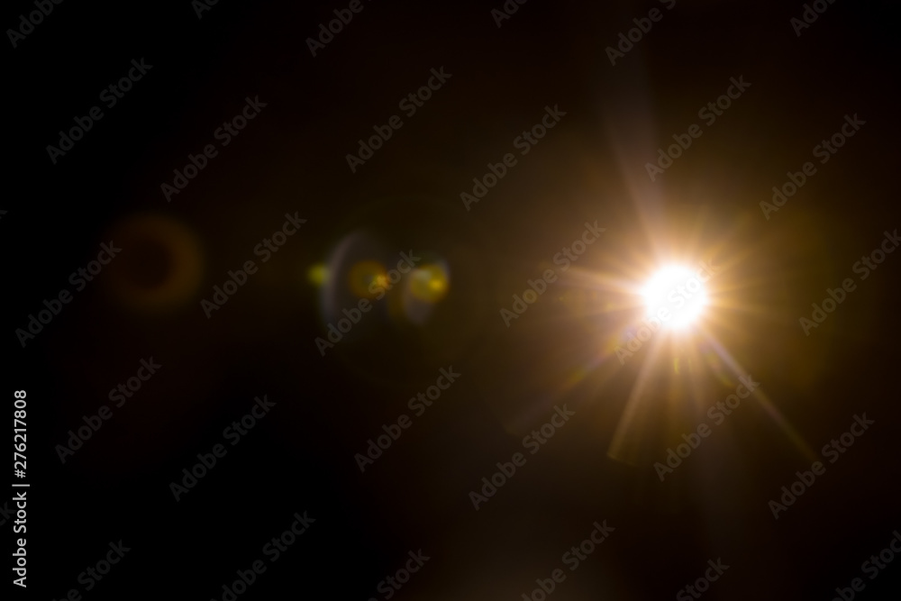 Abstract Natural Sun flare on the black background. Abstract Natural Sun flare on the black background.